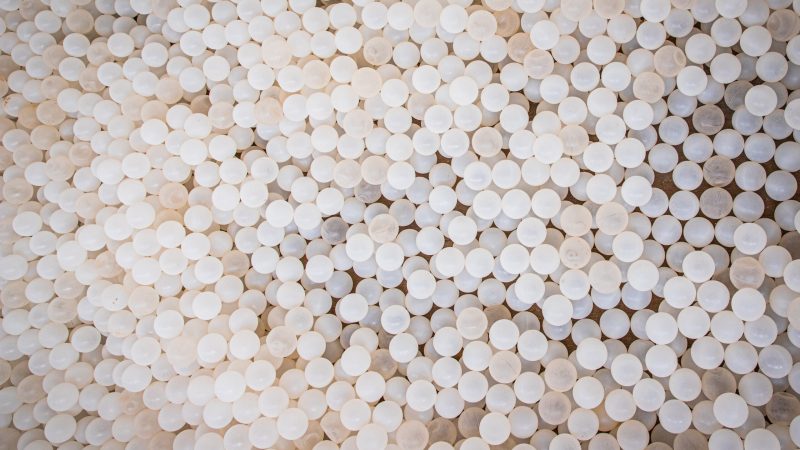 Texture of white plastic balls, top view photo